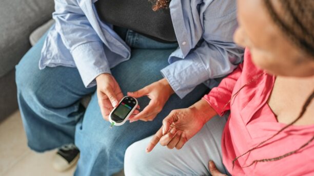 Woman with type 2 diabetes checking blood sugar